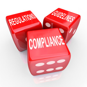 The words Compliance Regulations and Guidelines on three red dice to illustrate the need to follow rules and laws in conducting business